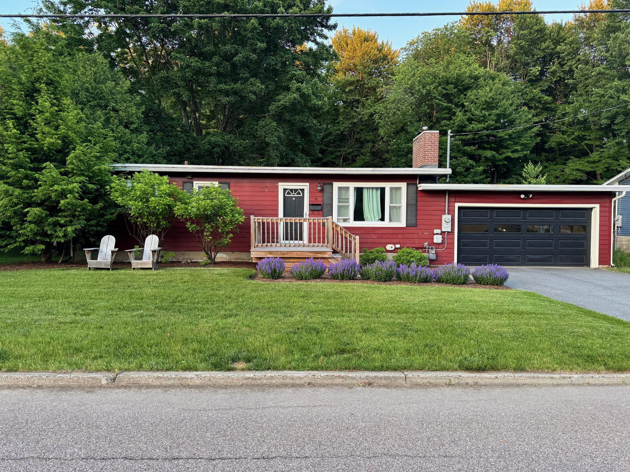 18 Victory Drive — a red ranch with lavender gardens under a blue Vermont sky